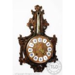 An early 20th century Black Forest novelty wall clock,
