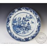 A large Chinese porcelain 18th century blue and white charger, of circular form,