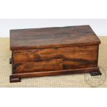A 17th century style elm chest, with hinged lid,