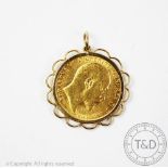 An Edward VII gold sovereign dated 1906, within 9ct gold pendant mount, gross weight 9.