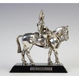 A silver plated 'Blues and Royals' Horseguard, on ebonised wood plinth,