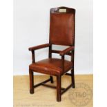 An oak and leather upholstered Presidents Chair,