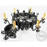A gothic style painted metal chandelier, with sic lights and felur de lys detailing,
