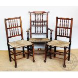 A harlequin set of six 19th century oak spindle back dining chairs, with rush seats on turned legs,