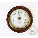 A late Victorian circular aneroid barometer 'J Casartelli & Son, Market St, Manchester',