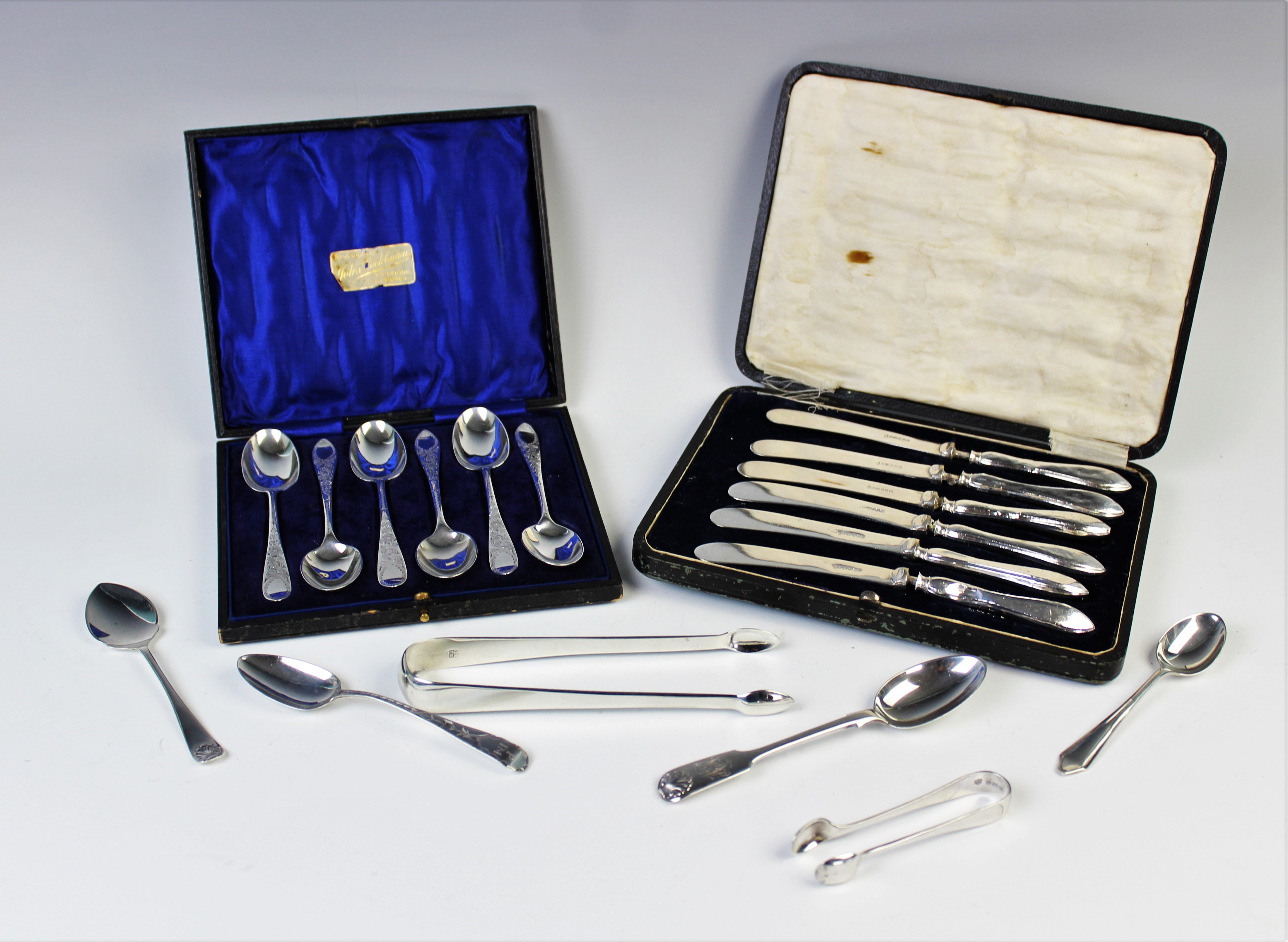 A selection of silver flatware to include an Edwardian cased set of six silver teaspoons,