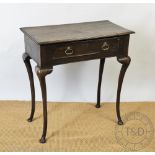 An oak side table, some 18th century timbers and later, with drawer, on cabriole legs and pad feet,
