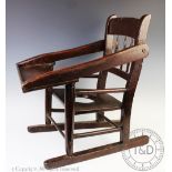 A late George III stained wood provincial child's chair with tray,