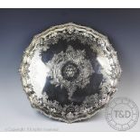A large silver plated salver, with elaborate pie crust rim,