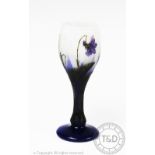 A Daum cameo glass liquor glass, decorated with violets, on a circular foot,