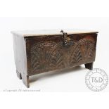 An early 18th century six plank coffer of small proportions,