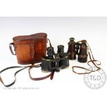 A pair of British military issue field glasses or binoculars,