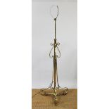 An early 20th century telescopic brass standard lamp, with scroll detailing,