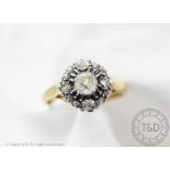 A diamond set cluster ring,