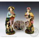 A pair of 19th century continental porcelain figures,