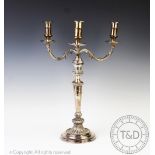 A silver plated three branch candelabra, each branch designed as an acanthus leaf,