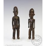 Two West African carved wood Lobi figures, probably Ivory Coast, mounted on to perspex basses,