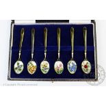 A cased set of six silver gilt and enamelled tea spoons Cohen and Charles, Birmingham 1991,