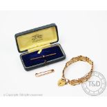 A 9ct gold gate bracelet, designed as articulated panels with an attached padlock clasp,