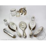 A collection of early 20th century silver mounted dressing table items,
