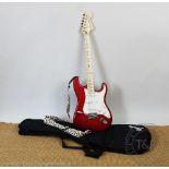 A Fender Squier Stratocaster electric guitar, 20th anniversary model, in red and white, 98.