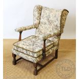 A pair of 1920's beech wing back chairs, on turned block legs, upholstered arms, 93cm H,
