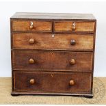 A George III oak chest, of two short and three long drawers,
