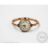 A seed pearl set lady's wristwatch, early 20th century, the circular face with seed pearl set bezel,