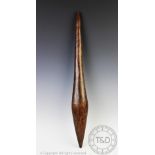 An Aboriginal throwing club/nulla, of tapered carved form with geometric decoration, 63.