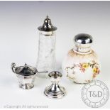 A selection of silver to include a Victorian silver topped Doulton Burslem scent bottle,