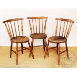 Three late 19th century beech and ash country kitchen chairs, with circular seats, on turned legs,