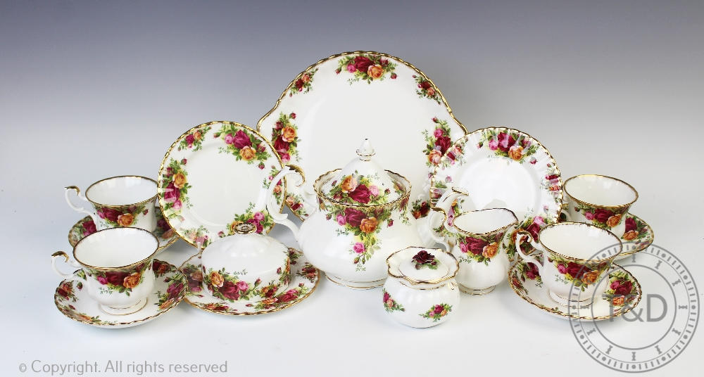 A Royal Albert Old Country Roses tea service comprising; a teapot, six teacups and saucers,