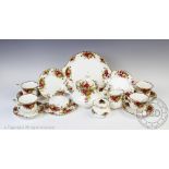 A Royal Albert Old Country Roses tea service comprising; a teapot, six teacups and saucers,