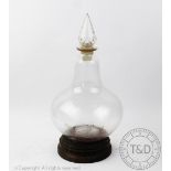 A late 19th century glass apothecary or chemist's bottle and stopper 44cm high,