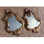 A pair of late 19th century Florentine carved gilt wood and gesso mirrors, in 18th century style,