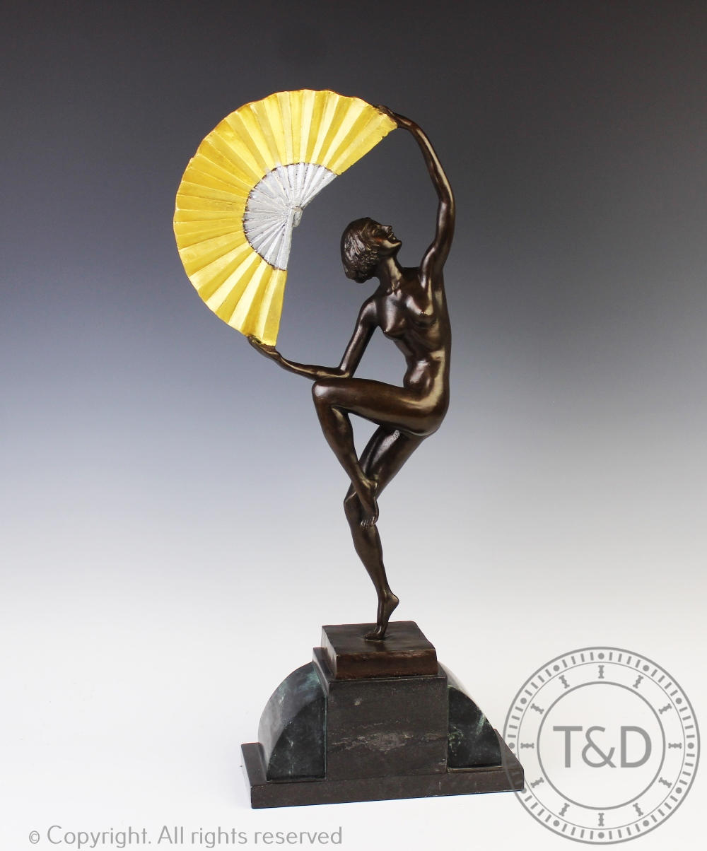 An Art Deco style bronzed female Fan dancer after Marcel Bouraine, upon stepped base, 57.