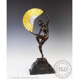 An Art Deco style bronzed female Fan dancer after Marcel Bouraine, upon stepped base, 57.