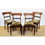 Five William IV mahogany dining chairs, with carved back rails on turned and reeded legs,