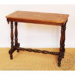 A Victorian inlaid walnut stretcher table, the top decorated with butterflies and flowers,