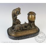After Isodore Bonheur, a figural bronze group of a cat and a seated monkey besides a cauldron,