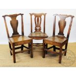 A pair of George III Welsh provincial oak chairs,