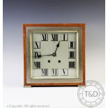 An Art Deco chrome and amboyna eight day mantel clock retailed by Tiffany and Co,