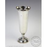 A silver vase, Elkington & Co, Birmingham 1965, of plain polished form with cusped and reeded rim,