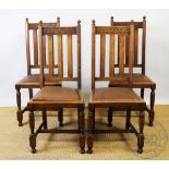 A set of four early 20th century oak dining chairs,