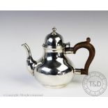 A silver bachelor's teapot Goldsmiths & Silversmiths Co Ltd, London 1939, of squat bulbous form,