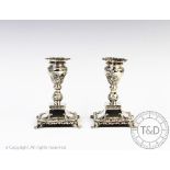 A pair of silver candlesticks, Sydney & Co, Birmingham 1902,