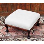 A 1920's stained beech stool of square form, with floral upholstered seat,