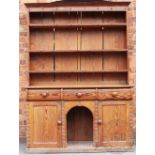 A late 19th century pitch pine country kitchen dresser,