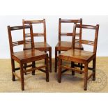 A set of four 19th century Welsh oak and ash dining chairs, with solid seats on tapered legs,