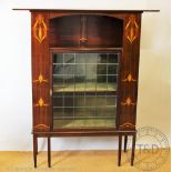 An inlaid Art Nouveau cabinet in the manner of Shapland and Petter,